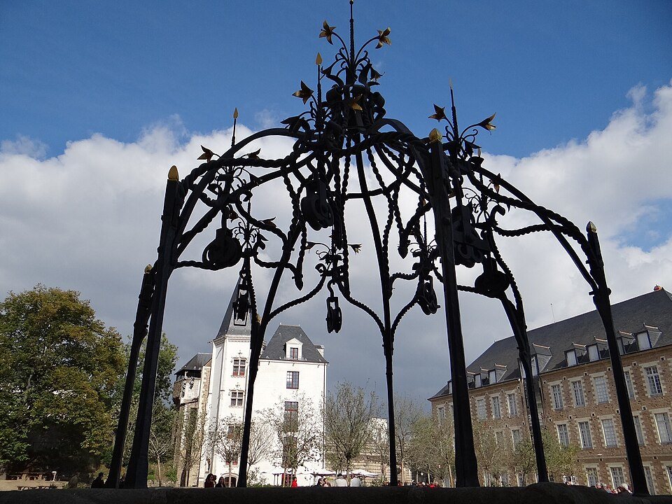 The wrought-iron well head in the courtyard